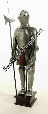 Miniature medieval knight in suit of armor holding halberd pole arm