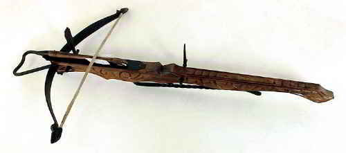 medieval carved crossbow with bolt - wooden