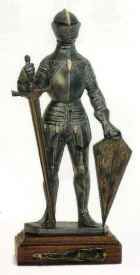 Miniature standing knight in suit of armor with sword and shield